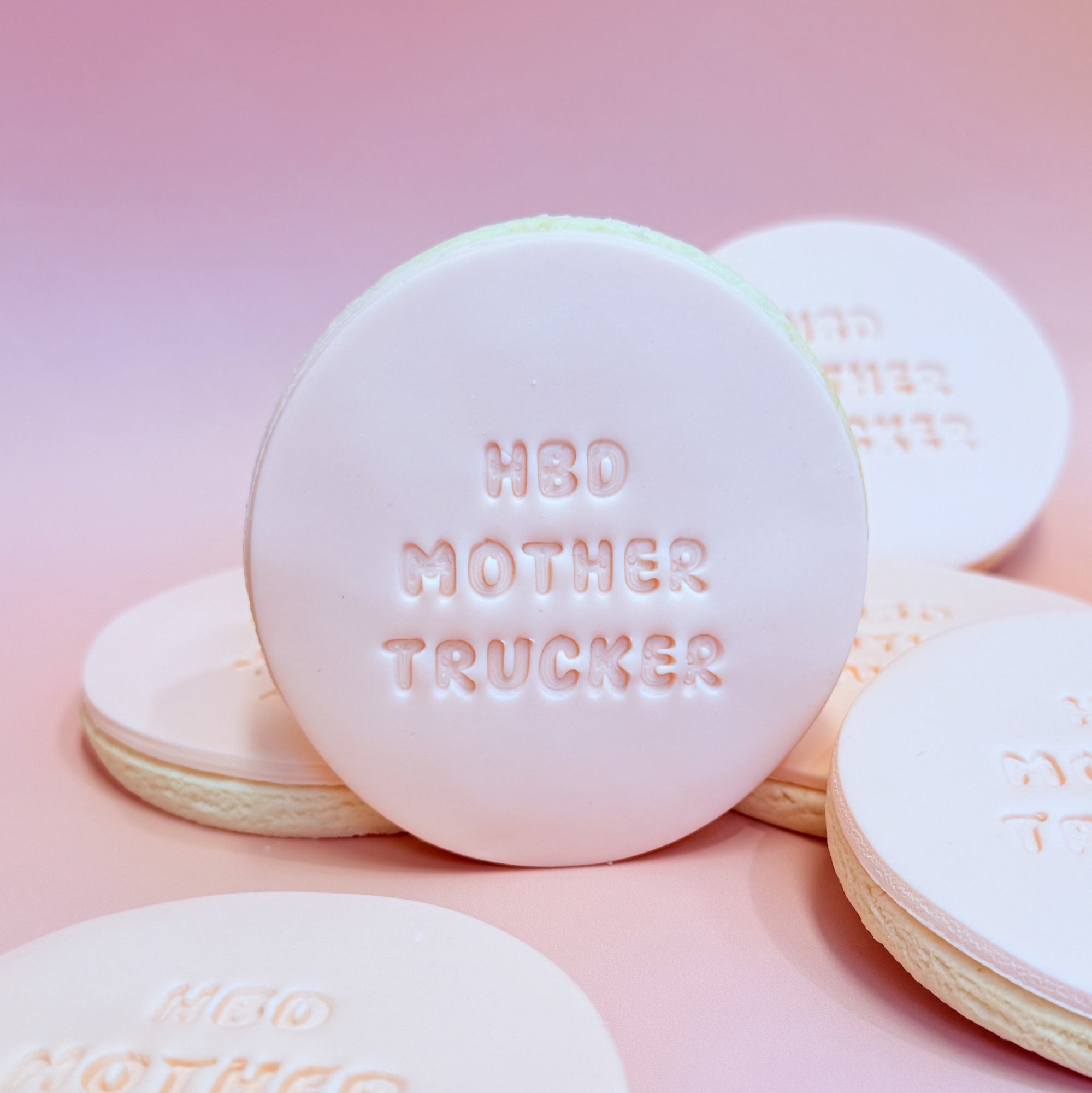 White cookies with text on a pink background Sugar Rush by Steph
