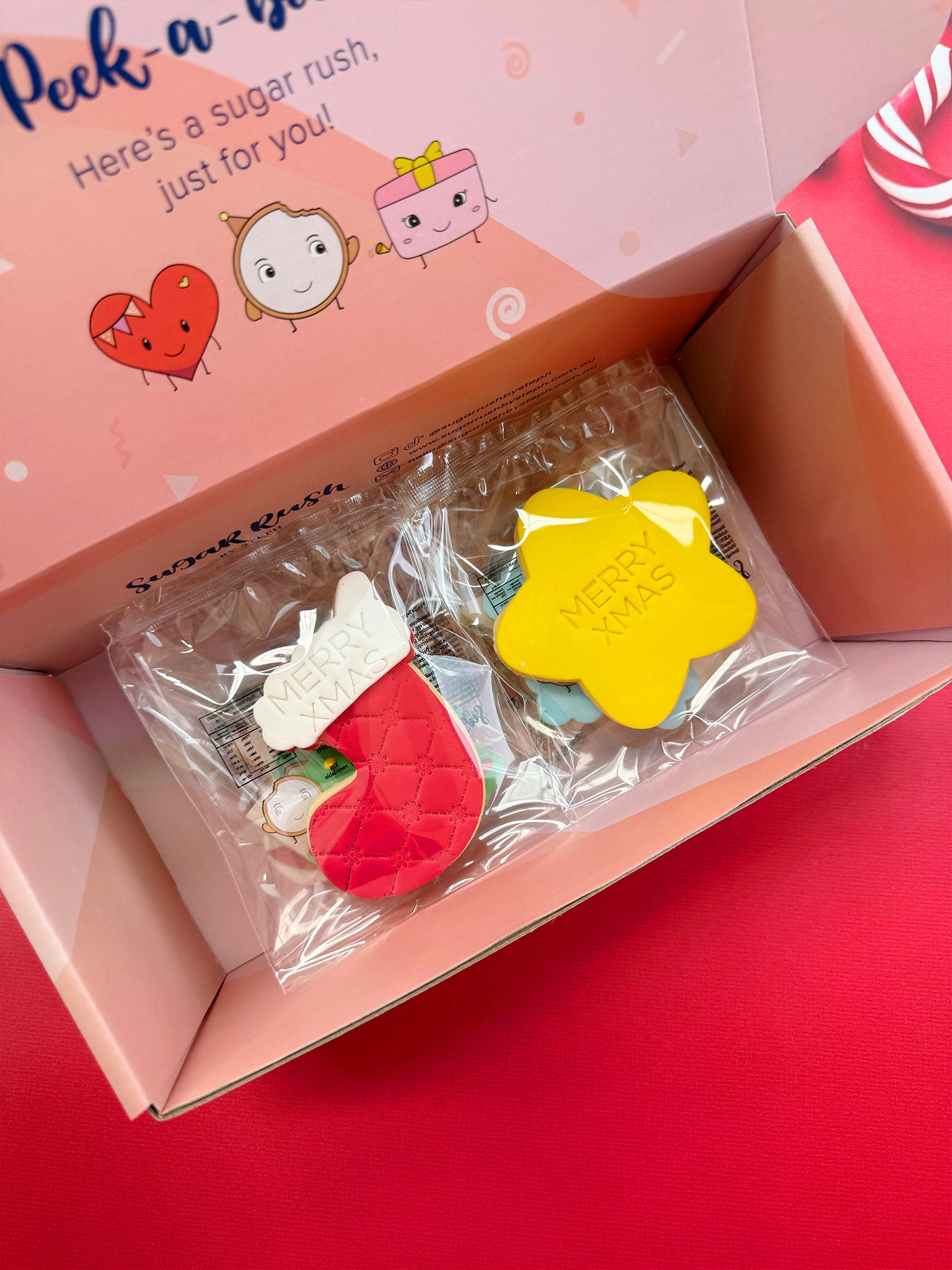 Decorative Christmas cookies with festive designs on a red background | Jolly Christmas Cookies | Personalised Christmas Cookie Box Delivery - Sugar Rush by Steph